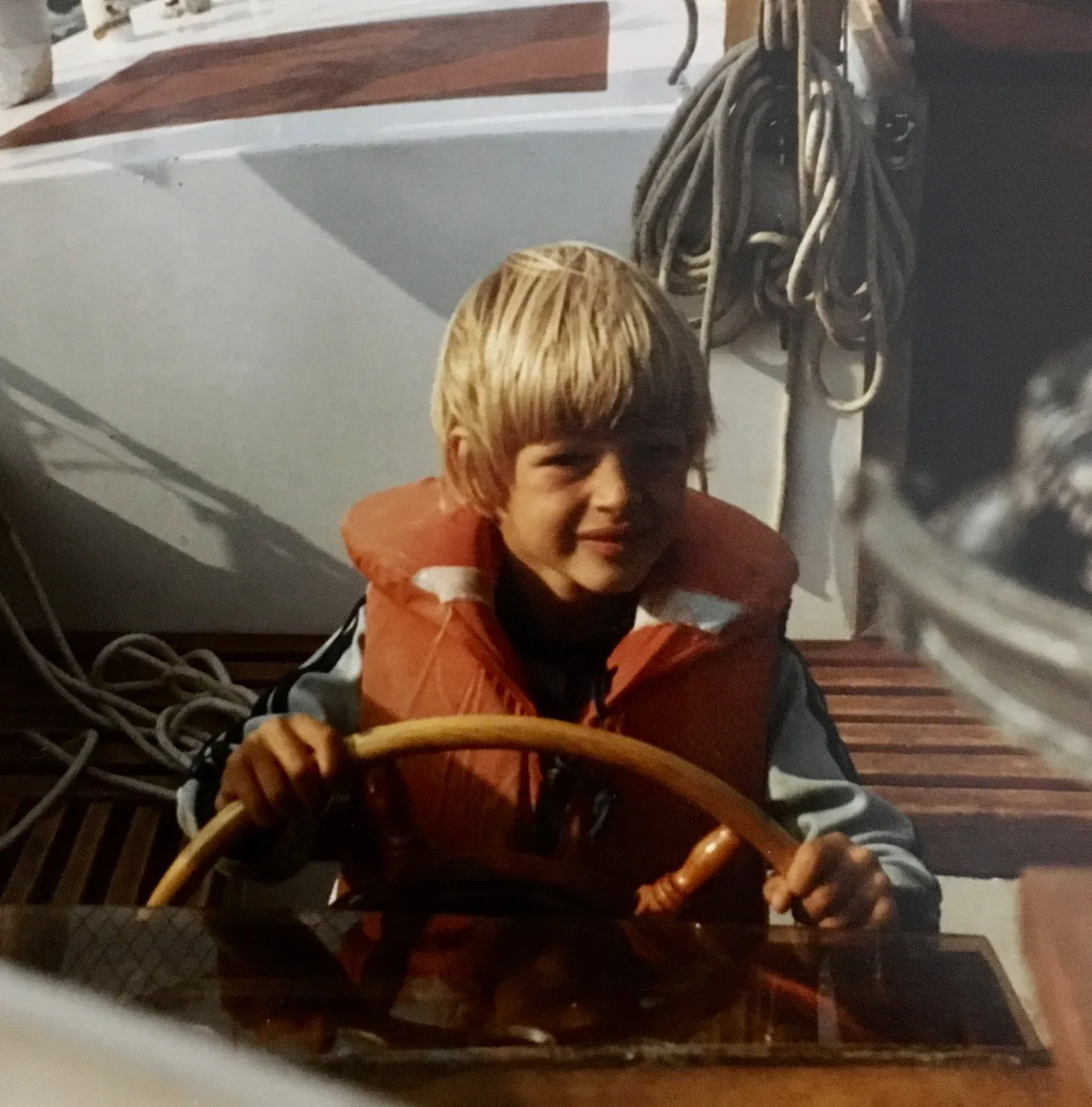 Bastiaan as a child at the helm of a sailing boat